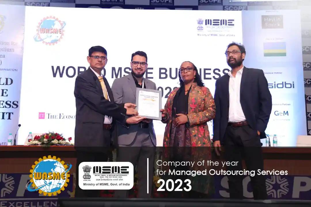OUTPRO receiving the Company of the Year award for Managed Outsourcing Services at the World MSME Business Summit 2023